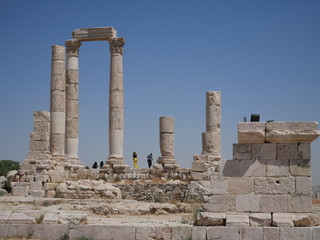 Fototapeta na wymiar Tall majestic pillars of the ruins of the Roman site of Amman Citadel on a hill in the city center of the capitol of Jordan