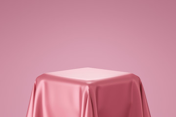 Pink pedestal or podium display with satin fabric platform concept on valentines background. Blank...
