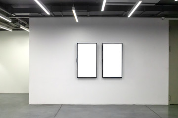Close up of two large photo frames or digital display
