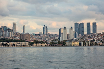 Panoramic view of the city. Houses, skyscrapers, sea and sky. Real estate and housing.