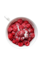 raspberries with sugar in mug. Top view.