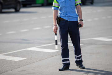 Road inspector with a baton.