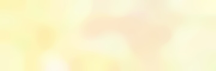 blurred bokeh horizontal background with lemon chiffon, blanched almond and corn silk colors and space for text