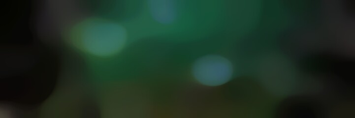 blurred horizontal background with very dark green, dark slate gray and black colors and space for text or image