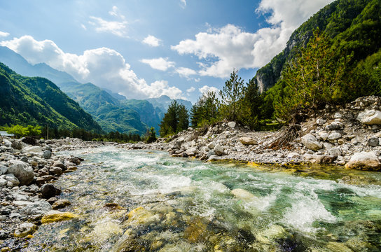 Crystal clear river Lumi i Thethit in National Park Theth in Albania