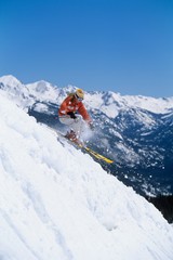 Naklejka na ściany i meble Skier Skiing Down Ski Slope