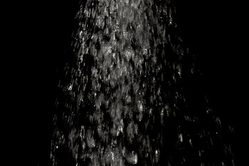 Water splash falling on black background