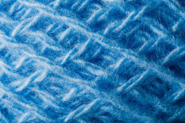 Wool yarn close-up colorful blue threads for needlework in macro.