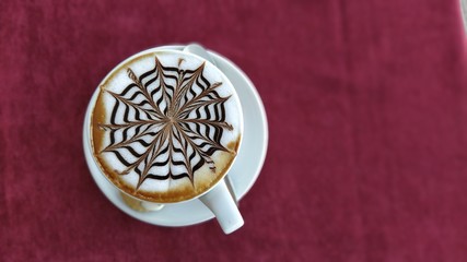 cup of cappuccino. white cup and cappuccino foam