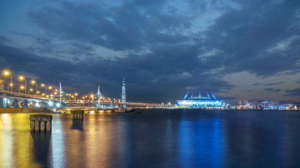 Fototapeta premium Petersburg Russia night landscape of modern city , view of the cable-stayed bridge over the Neva River, Stadium and the tower.