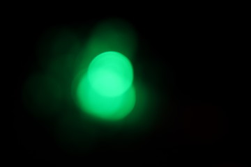 Christmas blurred green light snowflake bokeh with black background