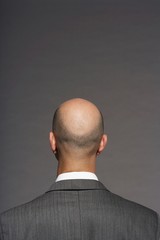 Rear View Of Bald Businessman