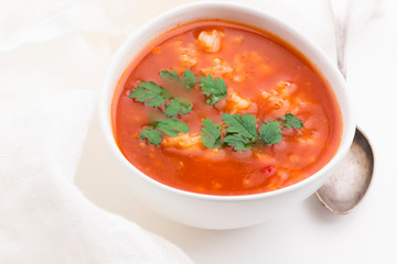 Tomato soup with rice decorated with parsley