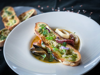 tasty seafood soup & grilled home made bread with spices