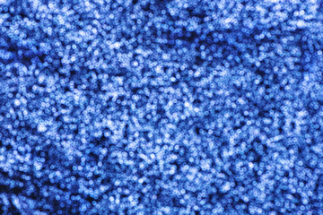 Blurred festive background with shiny sequins.