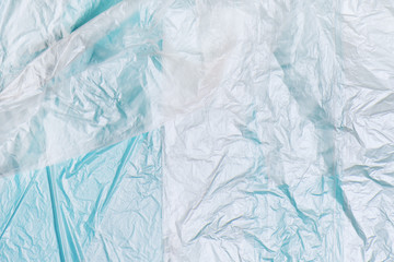 Plastic bags texture on blue background.