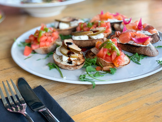 variety plate of bruschetta with fresh ingredients