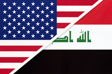 USA vs Republic of Iraq national flag from textile. Relationship between two american and asian countries.
