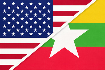 USA vs Republic of the Myanmar national flag from textile. Relationship between two american and asian countries.