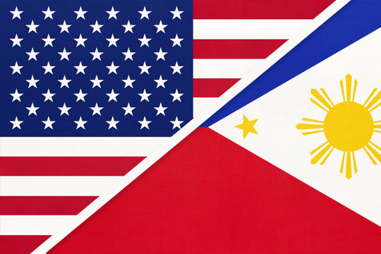 USA vs Philippines national flag from textile. Relationship between two american and asian countries.