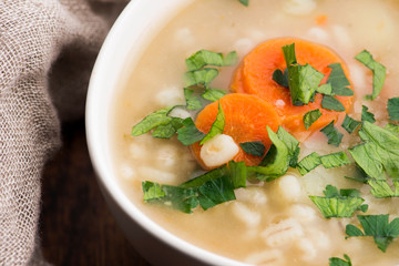 Barley soup, pearl barley in white bowl