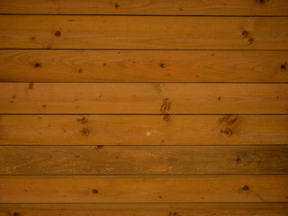 Slatted wooden board with knots and texture ideal for use as a background
