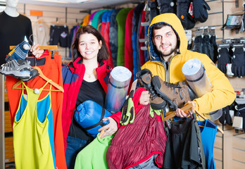 Couple showing purchases of camping equipment