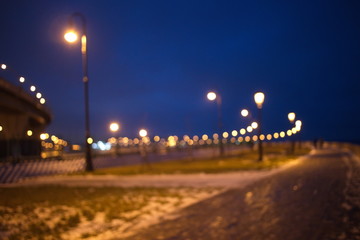 Blurry city lights in winter evening