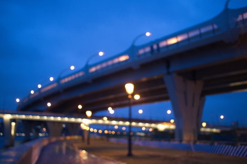 Fototapeta na wymiar Blurry city lights in winter evening