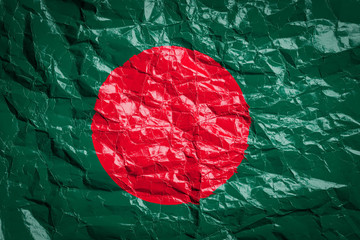 National flag of Bangladesh on crumpled paper. Flag printed on a sheet. Flag image for design on flyers, advertising.