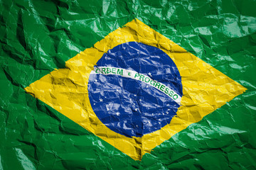 National flag of Brazil on crumpled paper. Flag printed on a sheet. Flag image for design on flyers, advertising.