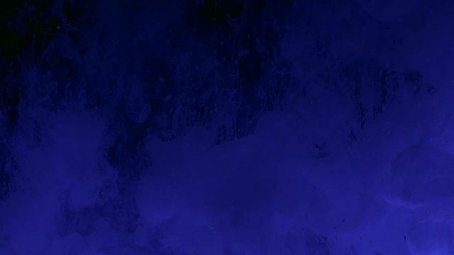 Slow motion video blue phantom technology abstract background. Blue watercolor ink on a black background. Winter background. Fantastic space background.