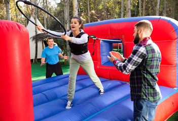 Woman playing tug of war with hoop