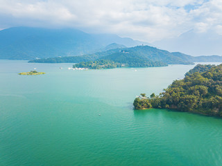 Aerial view of Sun Moon Lake with blue cloud sky background, viewed from flying drone