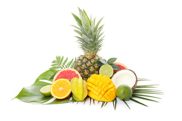 Fresh exotic fruits and palm leaves isolated on white background