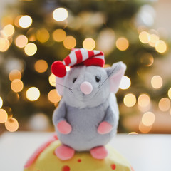 Little mouse toy, symbol of 2020. new year decoration. New Year 2020 Symbol. Greeting Christmas card.  Selective focus.