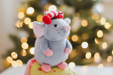 Little mouse toy, symbol of 2020. new year decoration. New Year 2020 Symbol. Greeting Christmas card.  Selective focus.
