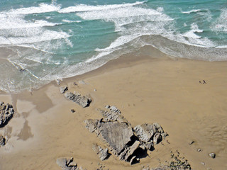 aerial view of waves on a beach