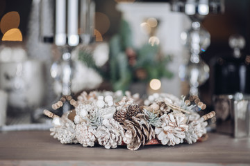 Silver decorative Christmas wreath made of natural materials. New Year eve concept