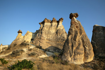 Fototapeta na wymiar Unusually shaped cliffs of volcanic origin in the Pashabag Valley in the Cappadocia region in Turkey.
