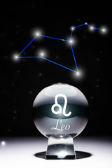 crystal ball with Leo zodiac sign isolated on black with constellation © LIGHTFIELD STUDIOS