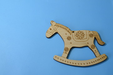 Backgrounds and textures. Winter, holidays. On a blue background wooden decorative toys.