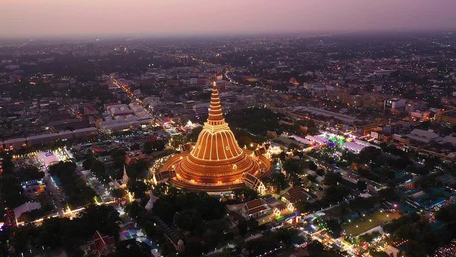 Aerial view point of interest of big golden pagoda decorated with lighting during sunset of Nakhon Phatom Province, Thailand
