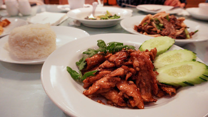 Thai Favorite Dish, Fried sliced pork with garlic on white plate.      