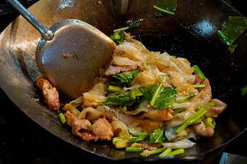 Stir fried flat noodle and pork with preserved soy bean paste stock photo