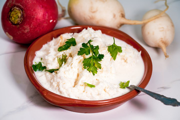 Grated radish porridge with parsley