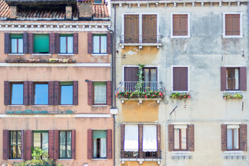 Fototapeta na wymiar Picturesque facade of a residential building in Venice, Italy