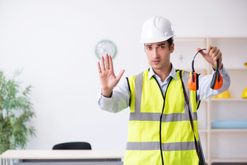 Young male architect working in the office