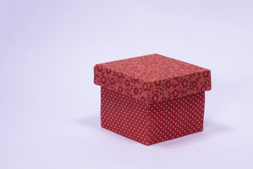 Packing, red box for christmas gifts with tinsel