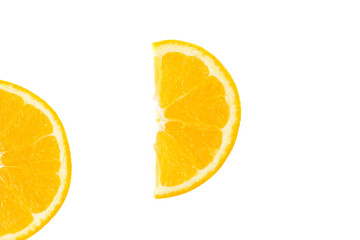 The juicy orange is cut across into semi-circular segments. Slices on White Background